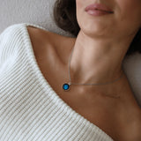 model wearing new moon renewal necklace with new moon