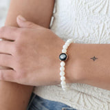 model wearing soleil brilliance bracelet in gold, close-up wrist shot