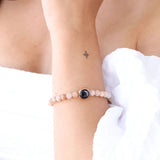 modelled wrist shot showing 10mm moon image charm on soleil brilliance bracelet in gold