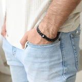 model wearing titan bracelet, unisex wrist shot