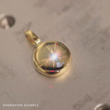 video showing example engraving on a gold moonglow pendant