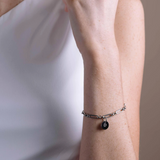 solar link bracelet in stainless steel worn on wrist, full view